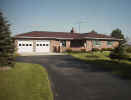 House with paved driveway